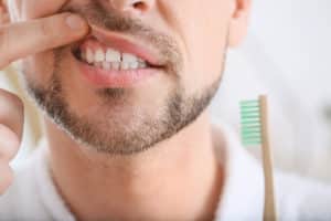 Man suffering from tooth ache in morning